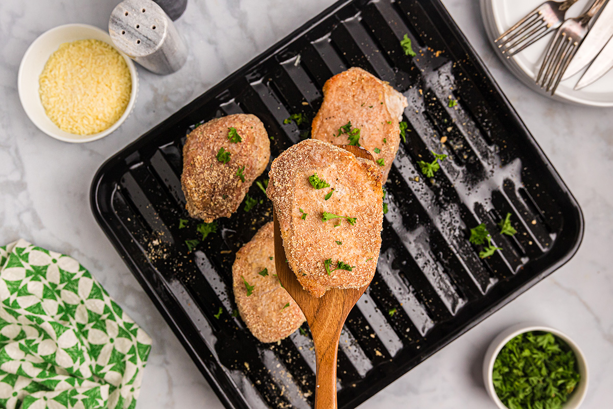 overhead shot of shake n bake pork chop on spatula
