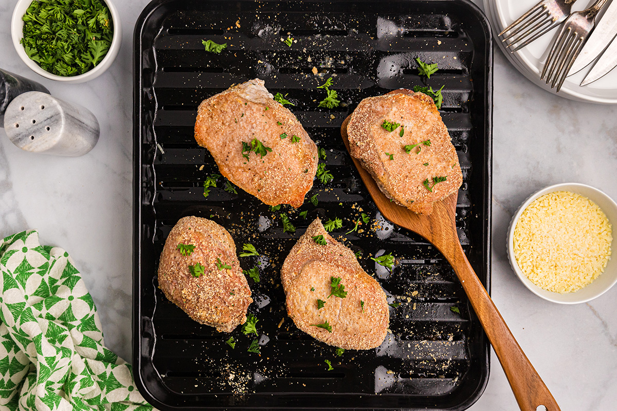 overhead shot of shake n bake pork chops on broiler pan