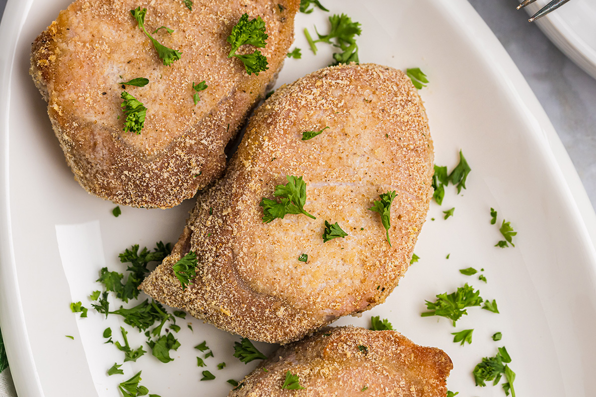 close up overhead shot of shake n bake pork chops on platter
