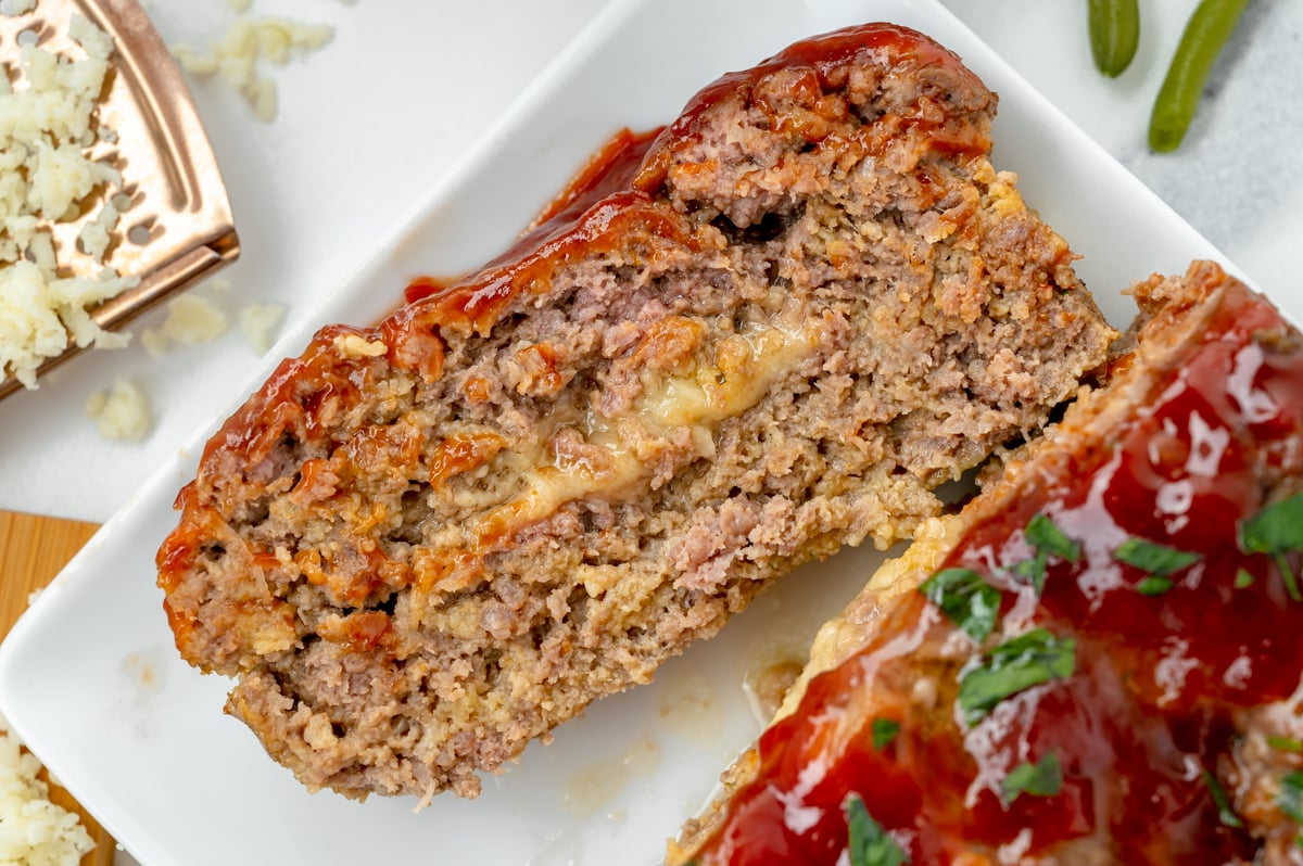 close up overhead shot of slice cut off of stuffed meatloaf