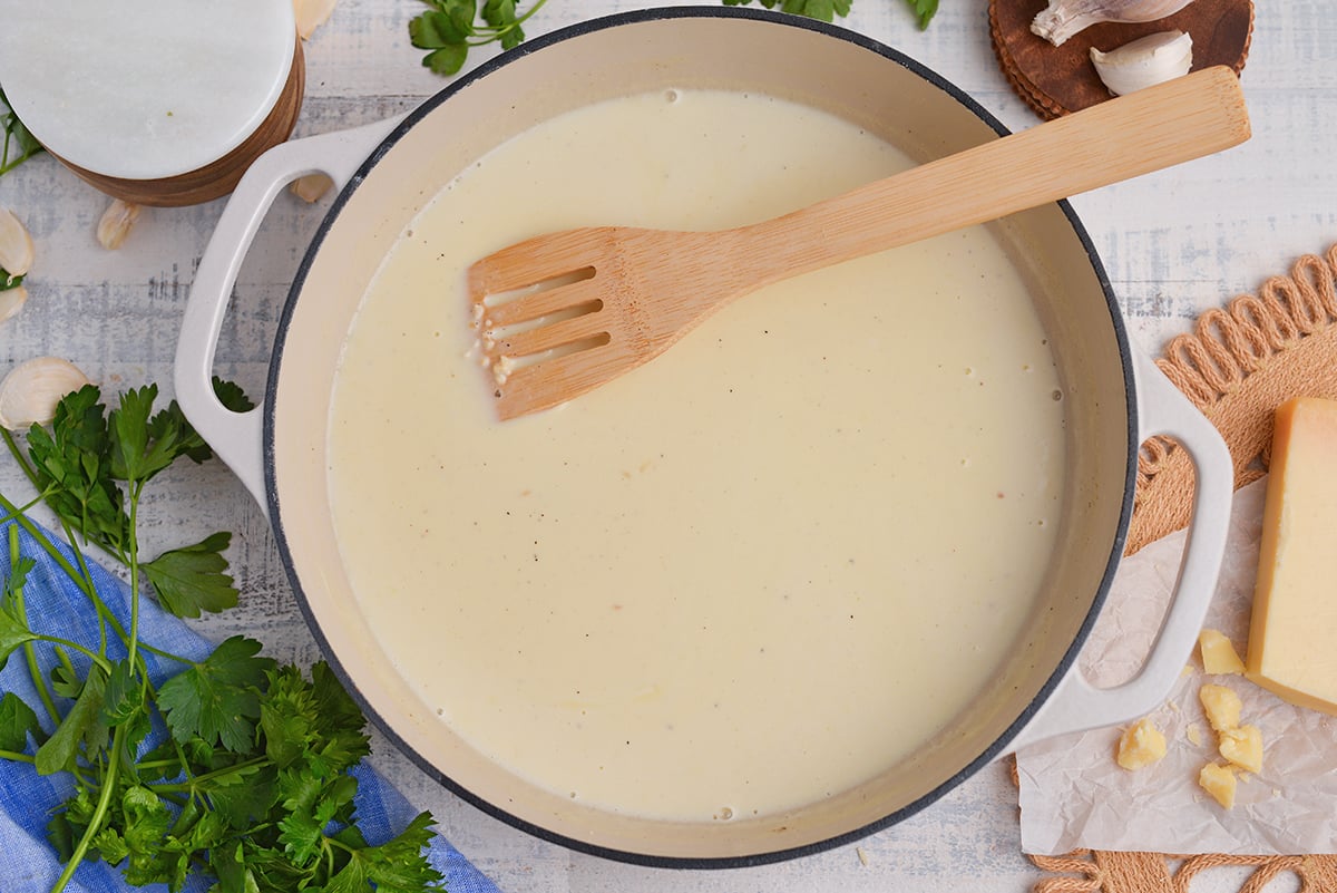 overhead shot of alfredo sauce in pan