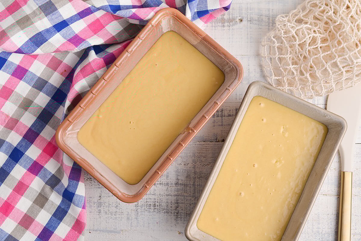 overhead shot of cake batter in two loaf pans