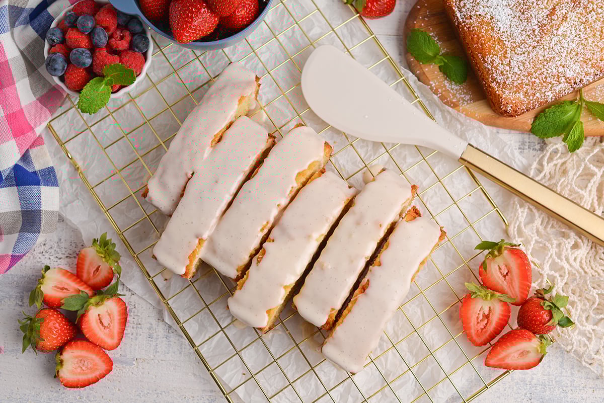 overhead shot of sliced vanilla pound cake topped with glaze