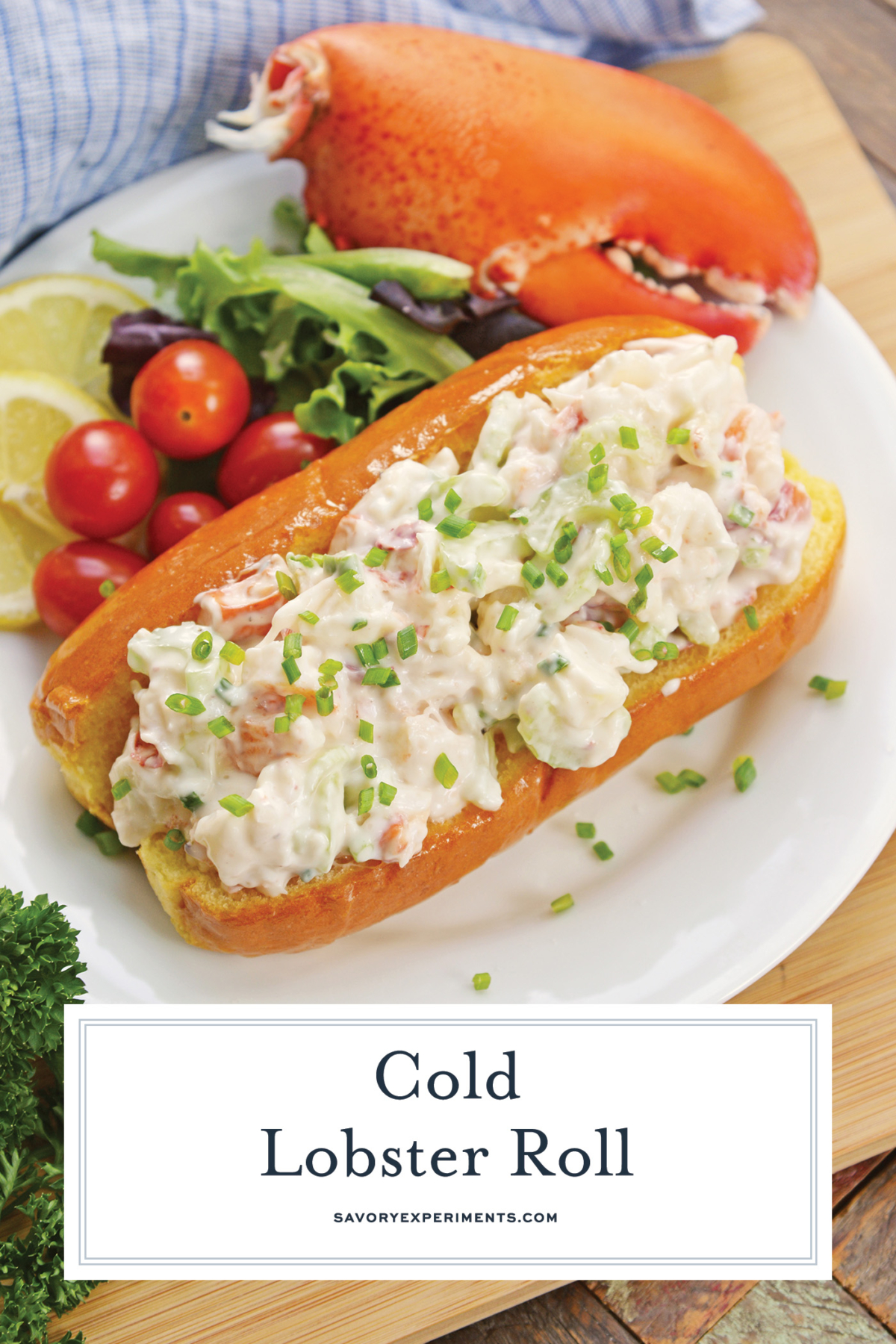 overhead view of cold lobster roll on plate with text overlay