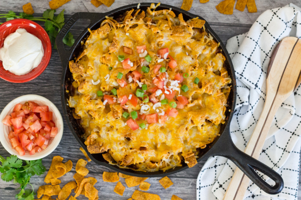 overhead of frito pie in a cast iron skillet