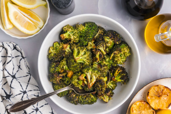 overhead shot of spoon in bowl of grilled broccoli