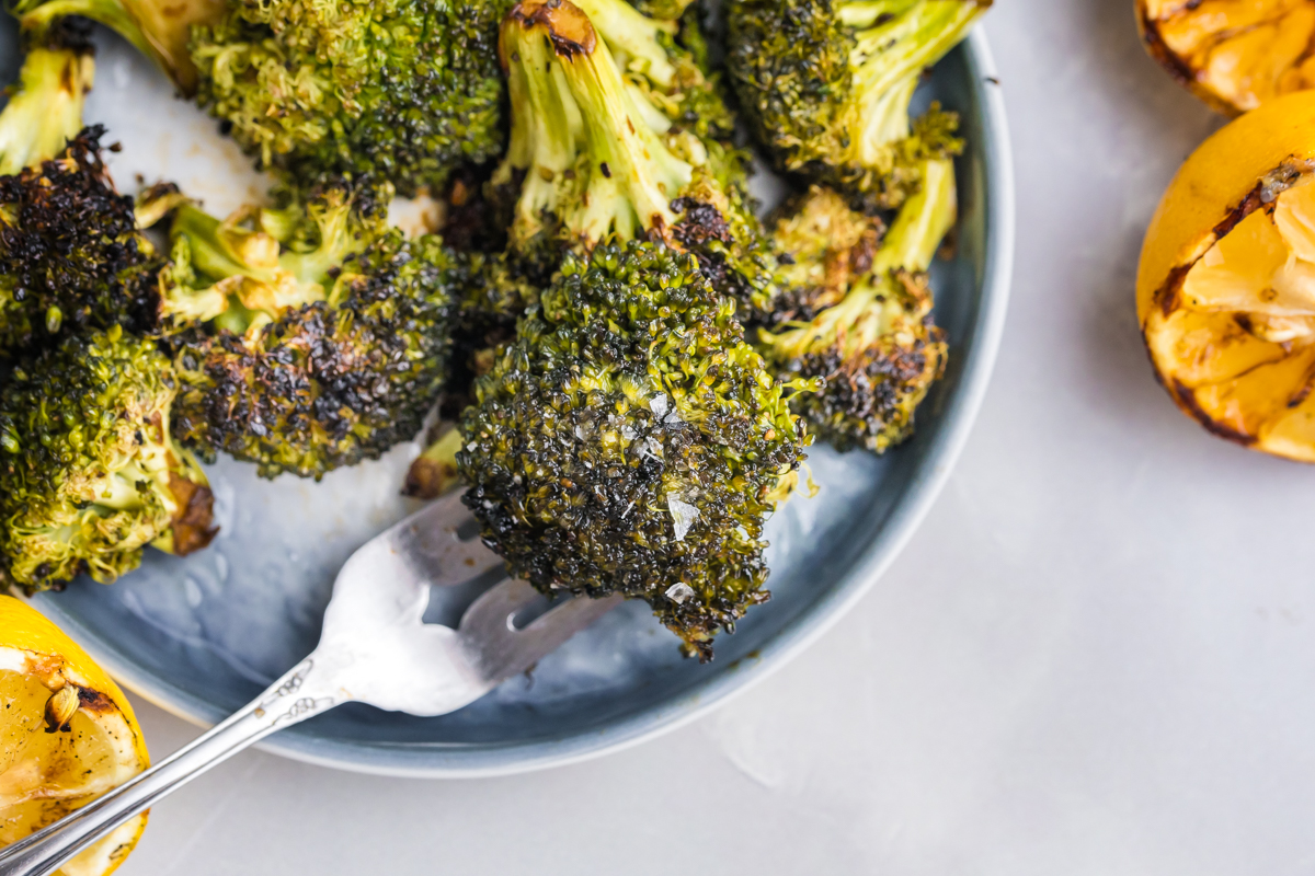 bite of grilled broccoli on fork