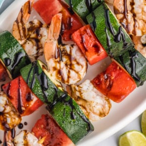 close up overhead shot of platter of grilled watermelon shrimp kabobs