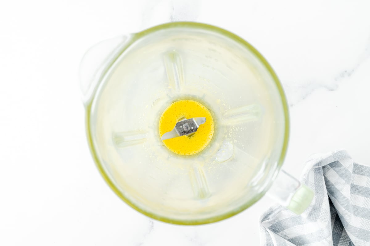 overhead shot of egg yolks in blender