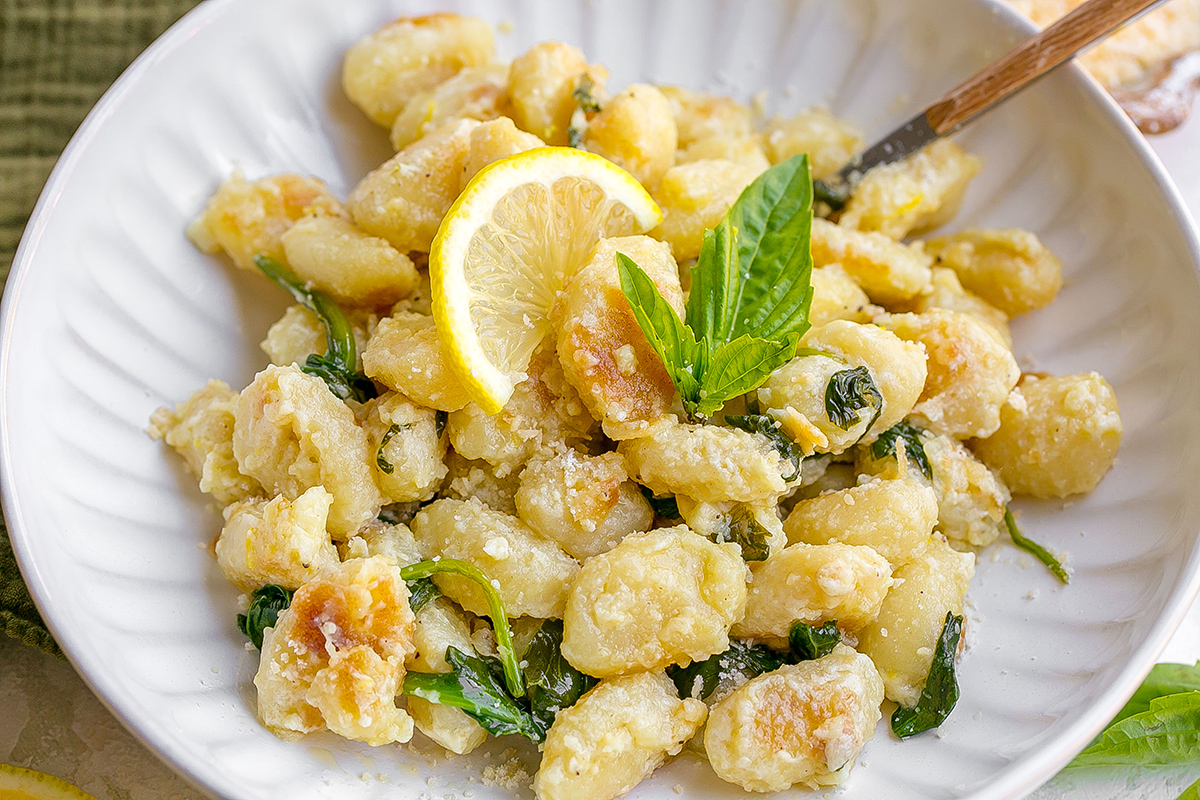 angled shot of pan fried gnocchi on plate