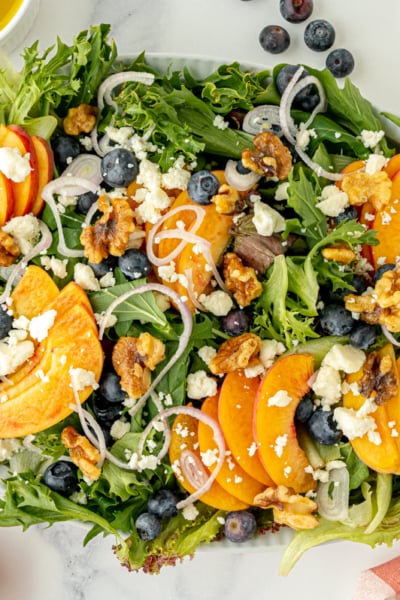 overhead shot of serving dish of peach salad