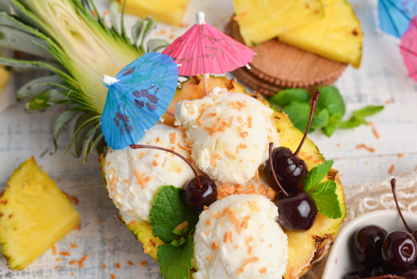 close up overhead shot of pina colada ice cream in pineapple