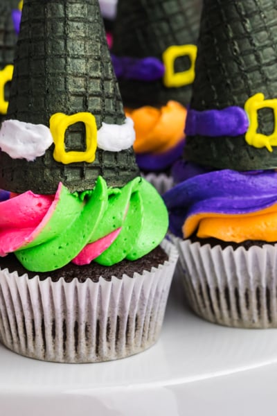 close up of platter of witch hat cupcakes