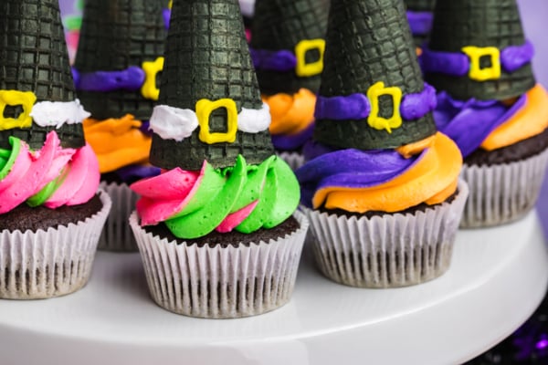 close up of platter of witch hat cupcakes