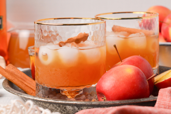 close up straight on shot of two apple cider whiskey cocktails