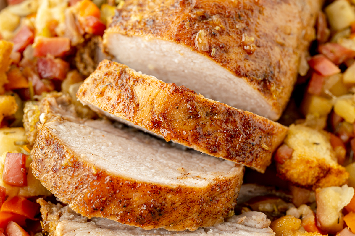 angled shot of sliced apple spiced pork tenderloin