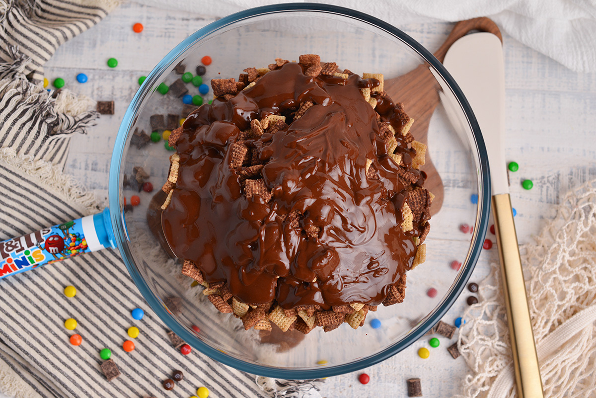 melted chocolate in bowl of chocolate chex cereal