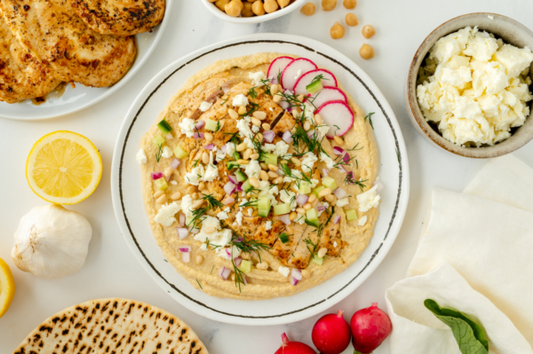 overhead shot of greek chicken hummus bowl