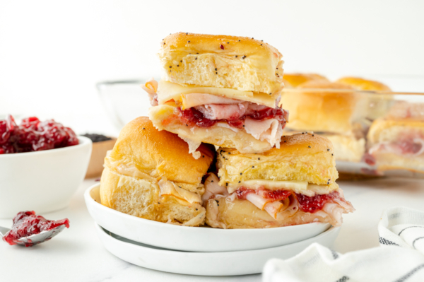 straight on shot of stack of cranberry turkey sliders on a plate
