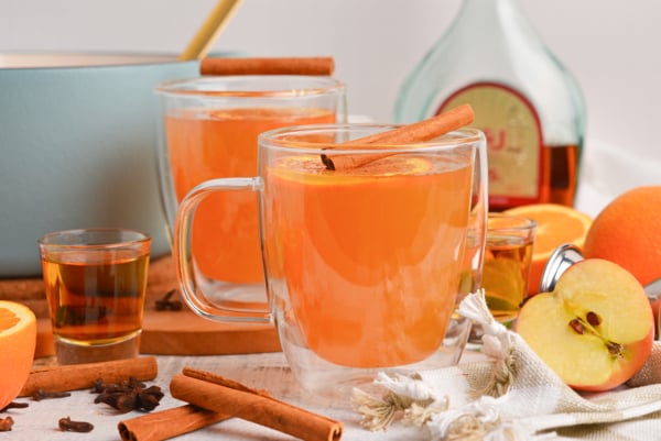 straight on shot of two mugs of wassail