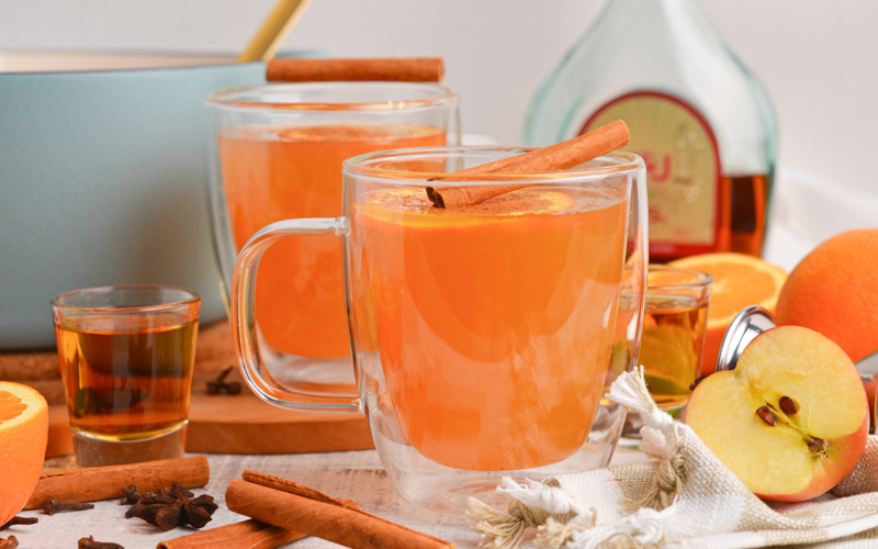 straight on shot of two mugs of wassail