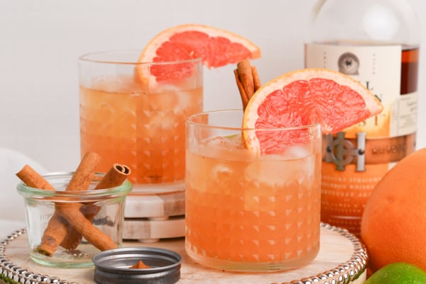 straight on shot of two whiskey grapefruit cocktails