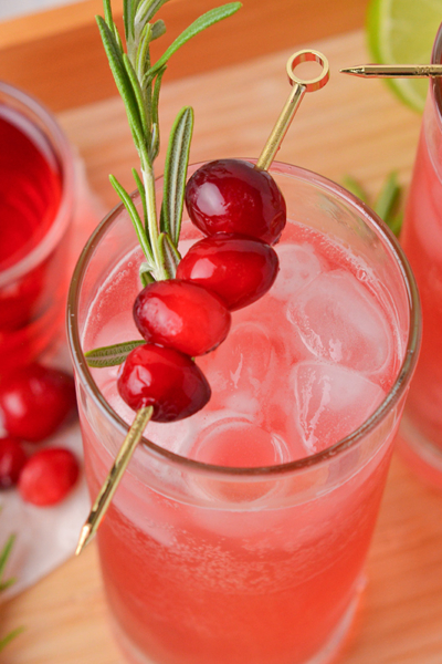 close up angled shot of cranberry whiskey sour