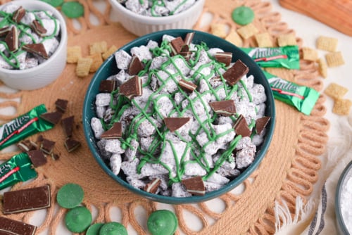 angled shot of bowl of mint chocolate chip muddy buddies