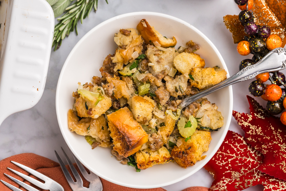 close up overhead shot of fork in bowl of traditional stuffing