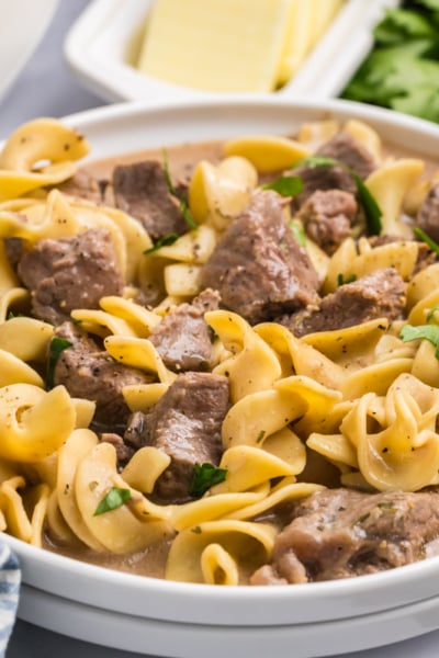 angled shot of plate of crock pot beef and noodles