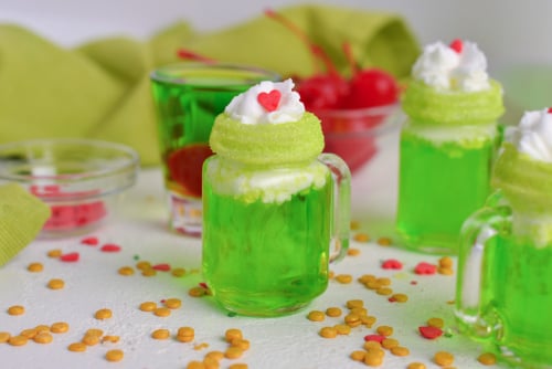 straight on shot of christmas shot topped with whipped cream