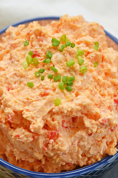 angled shot of bowl of pimento cheese spread
