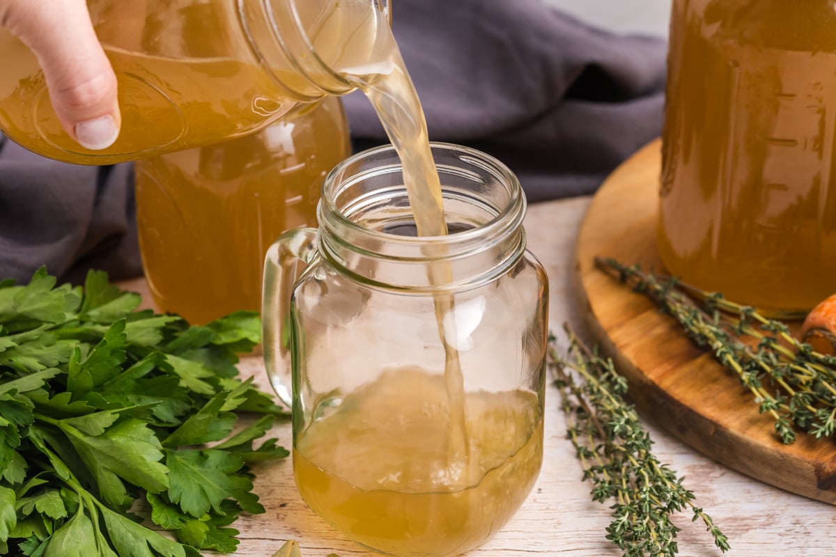 turkey stock pouring into jar