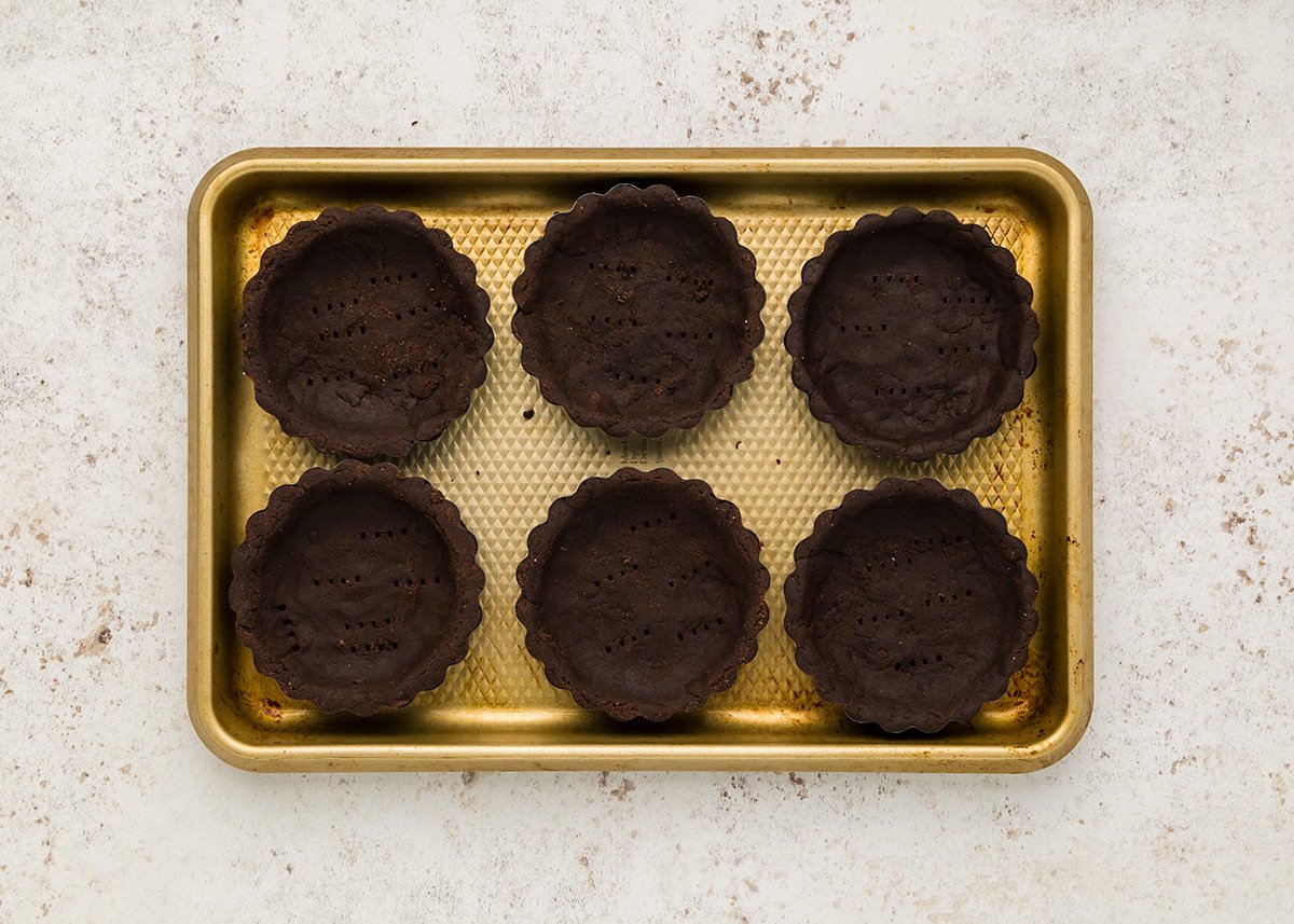 overhead shot of chocolate crusts on baking sheet