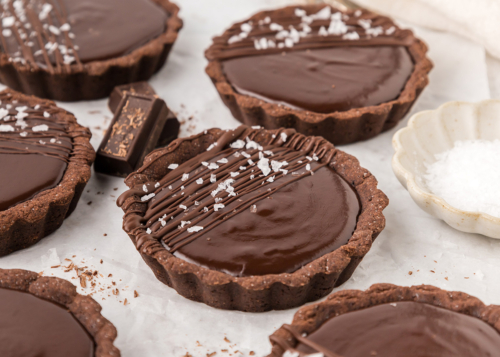 close up angled shot of chocolate tartlets