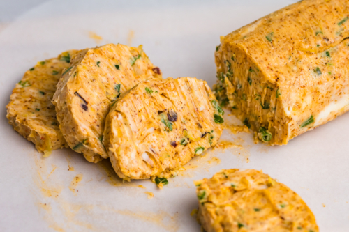 angled shot of sliced butter log