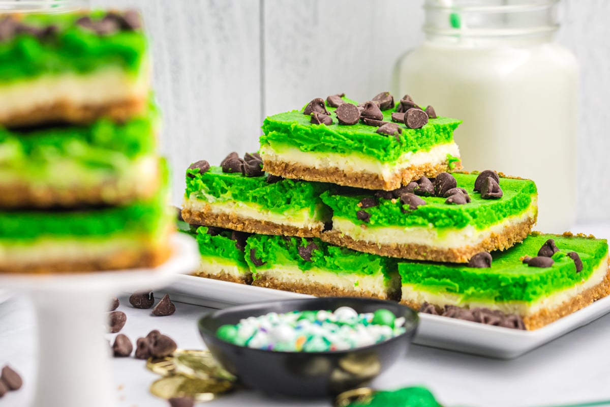 stack of grasshopper cheesecake bars on platter