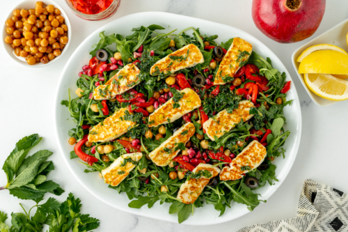 overhead shot of fried halloumi salad on platter