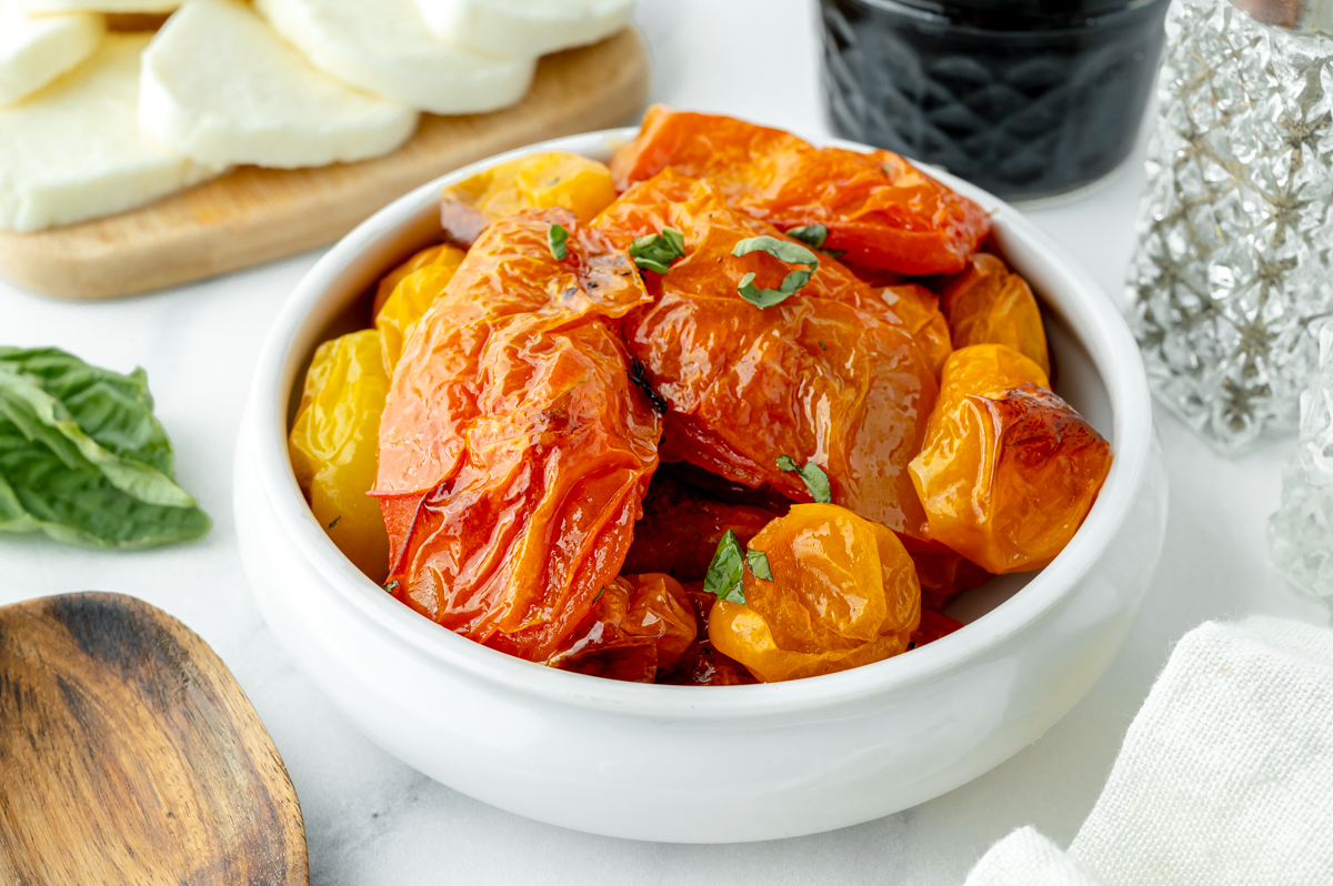 angled shot of bowl of roasted tomatoes