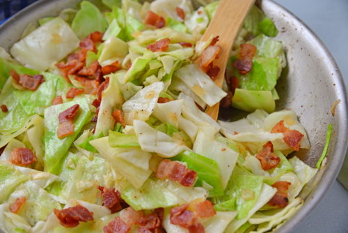 Fried Cabbage with bacon in skillet