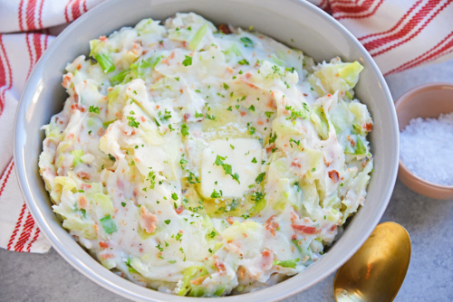 Overhead of iris colcannon in a bowl and topped with butter