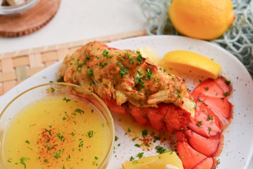 angled shot of plate of stuffed lobster tail