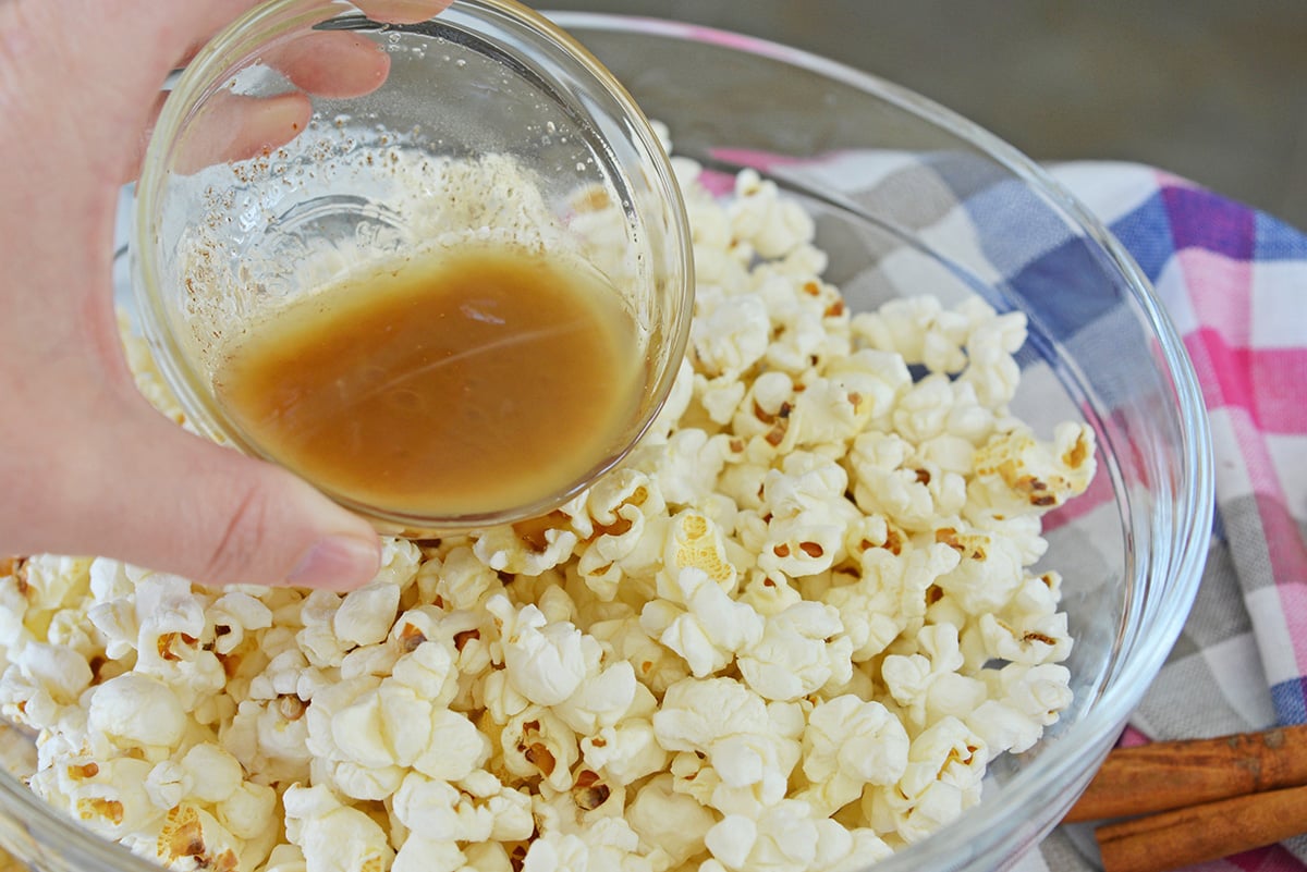 honey cinnamon mixture poured over popcorn