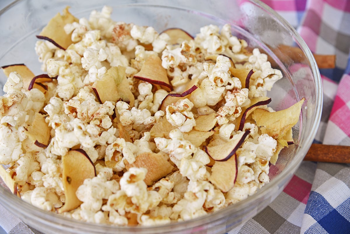 close up angled shot of bowl of apple cinnamon popcorn