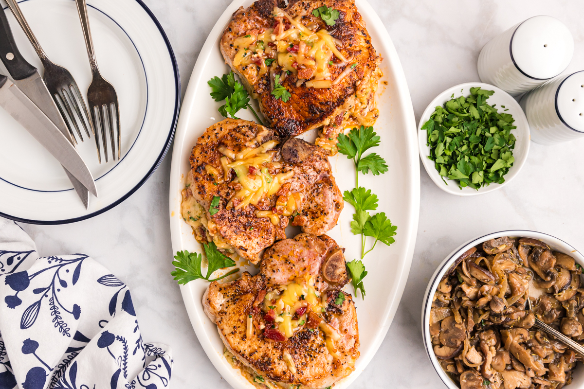 overhead shot of platter of baked stuffed pork chops