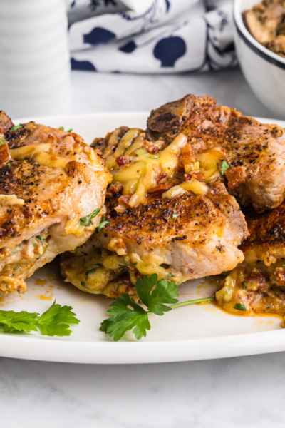 platter of baked stuffed pork chops