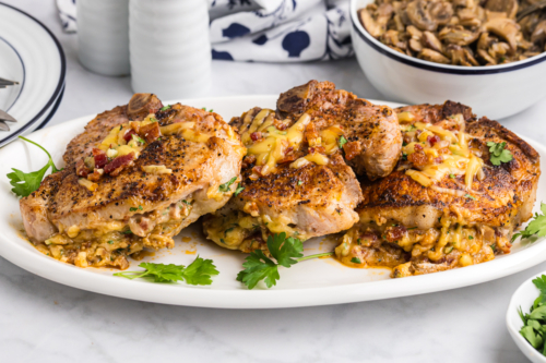 platter of baked stuffed pork chops