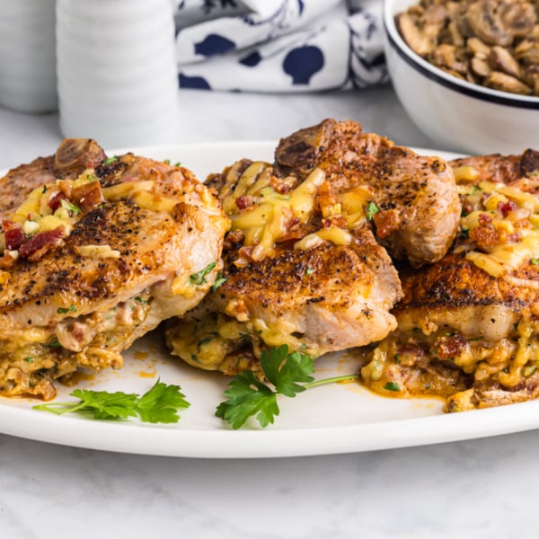 platter of baked stuffed pork chops
