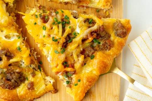 close up overhead shot of slice of pizza on spatula