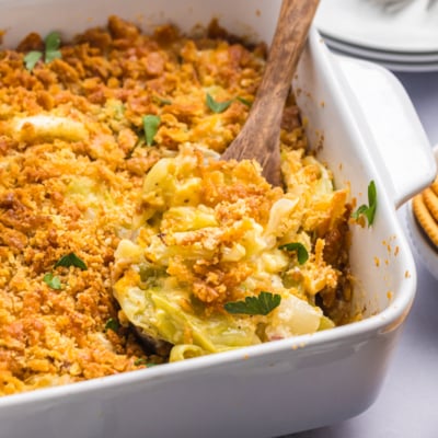 angled shot of wooden spoon in cabbage casserole